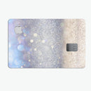 Light Blue and Tan Unfocused Orbs of Light - Premium Protective Decal Skin-Kit for the Apple Credit Card