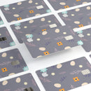 Scattered Easter Basket Over Gray - Premium Protective Decal Skin-Kit for the Apple Credit Card