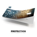 Teal and Gold Grungy Orbs of Light - Premium Protective Decal Skin-Kit for the Apple Credit Card