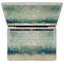 MacBook Pro with Touch Bar Skin Kit - Teal_and_Gold_Unfocused_Orbs_of_Light-MacBook_13_Touch_V4.jpg?