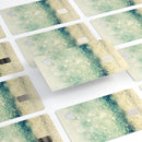 Teal and Gold Unfocused Orbs of Light - Premium Protective Decal Skin-Kit for the Apple Credit Card