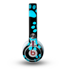 The Black & Turquoise Paw Print Skin for the Beats by Dre Mixr Headphones