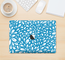 The Light Blue & White Floral Sprout Skin Kit for the 12" Apple MacBook (A1534)