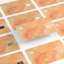 The Orange Watercolor Grunge Surface with Polka Dots - Premium Protective Decal Skin-Kit for the Apple Credit Card