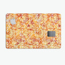 The Watercolor Orange and Red Snow Crystal - Premium Protective Decal Skin-Kit for the Apple Credit Card
