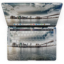 MacBook Pro with Touch Bar Skin Kit - Vivid_Cloudy_Sky_Over_The_City_Skyline-MacBook_13_Touch_V4.jpg?