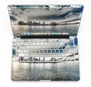 Vivid_Cloudy_Sky_Over_The_City_Skyline_-_13_MacBook_Pro_-_V4.jpg