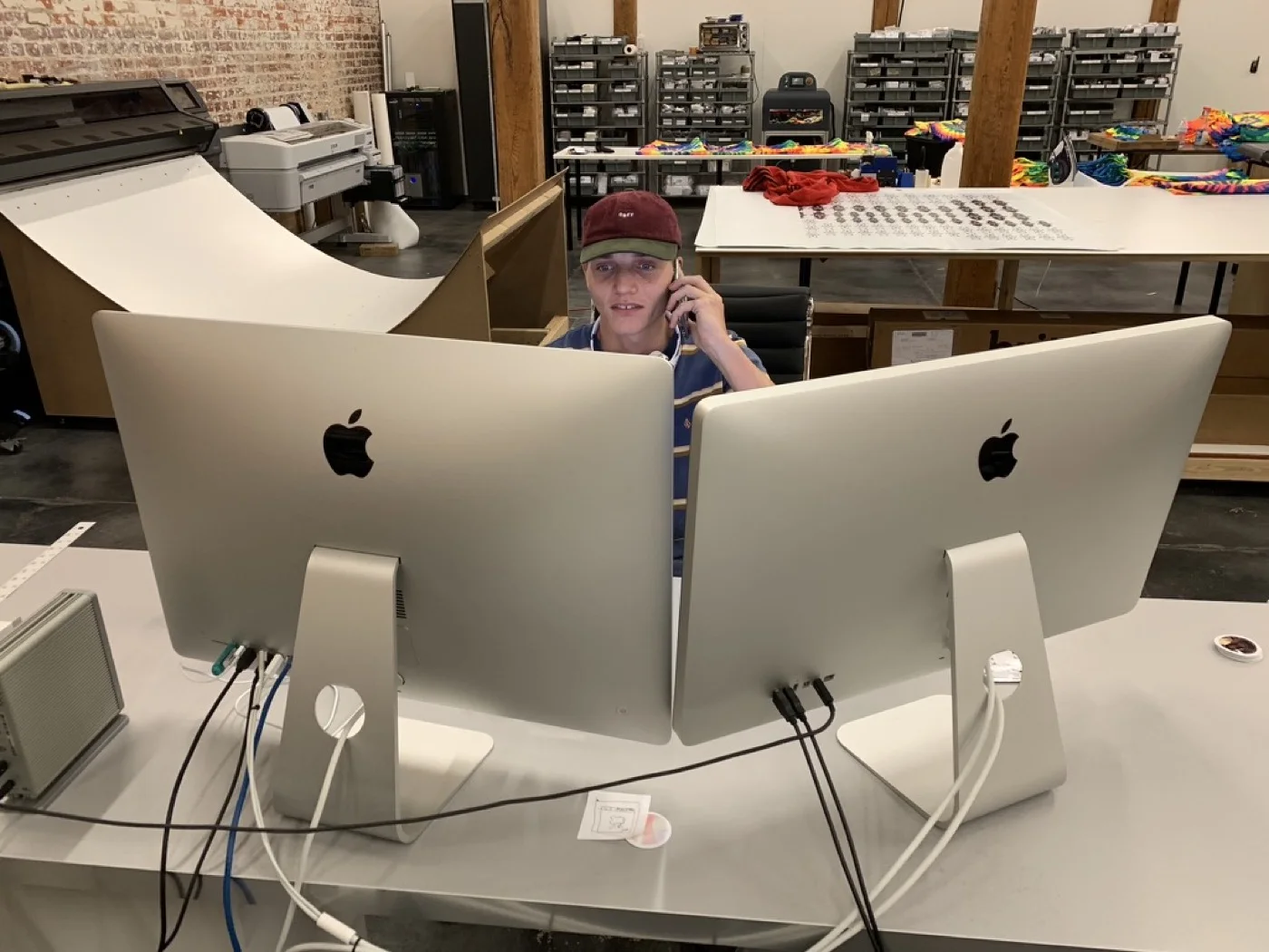 Holding it all down between two iMacs
