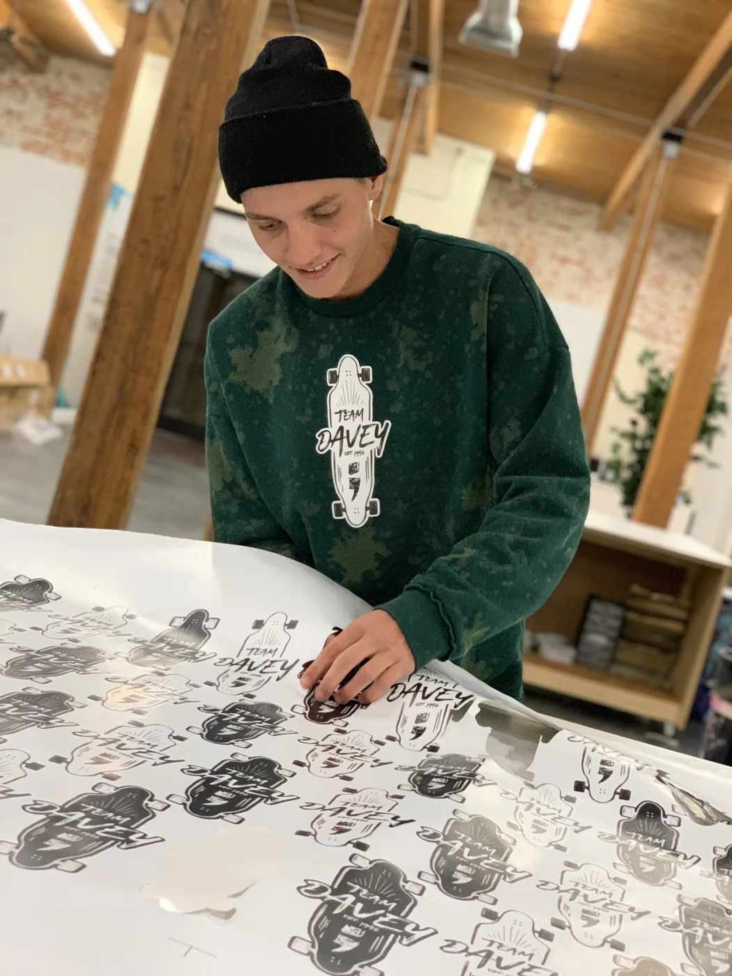 Weeding a sheet of longboard decals at the big table